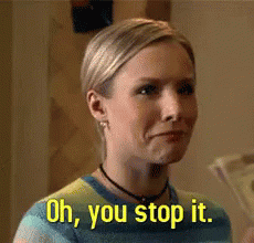 A Woman In A Striped Shirt Is Saying Oh , You Stop It GIF
