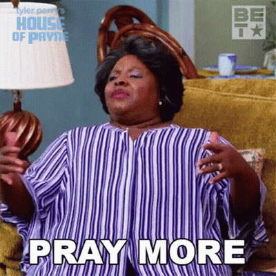 A Woman In A Striped Shirt Is Sitting On A Couch Saying Pray More GIF