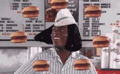 A Woman In A Striped Shirt Is Surrounded By Hamburgers On Her Head . GIF