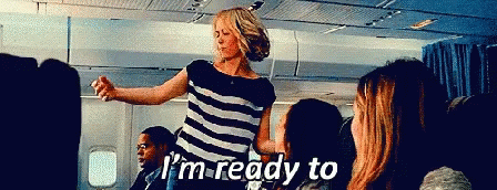 A Woman In A Striped Shirt Says I 'M Ready To On A Plane GIF