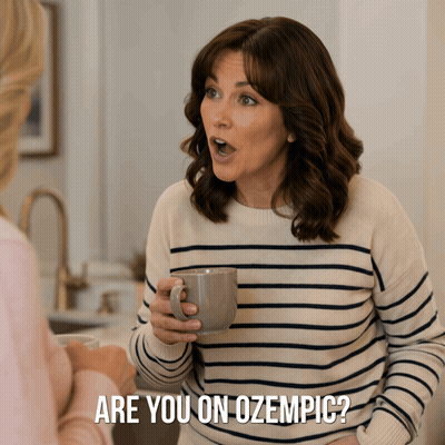 A Woman In A Striped Sweater Is Holding A Cup Of Coffee And Says Are You On Ozempic GIF