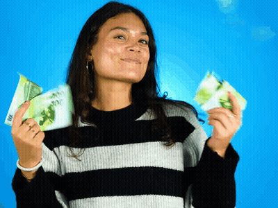 A Woman In A Striped Sweater Is Holding A Stack Of 100 Dollar Bills In Her Hands GIF