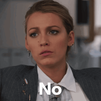A Woman In A Suit And Tie Has The Word No Written On Her Face GIF