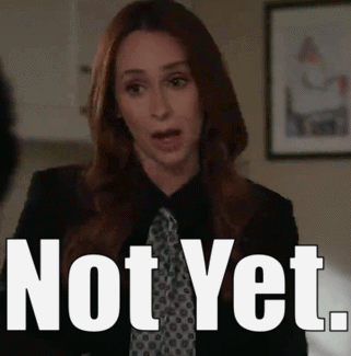 A Woman In A Suit And Tie Says Not Yet .. GIF