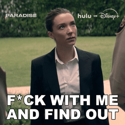A Woman In A Suit And White Shirt Says " F * Ck With Me And Find Out " GIF