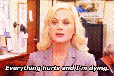 A Woman In A Suit Is Saying Everything Hurts And I 'M Dying GIF