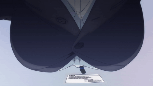 A Woman In A Suit Is Sitting At A Desk With A Piece Of Paper On The Table GIF