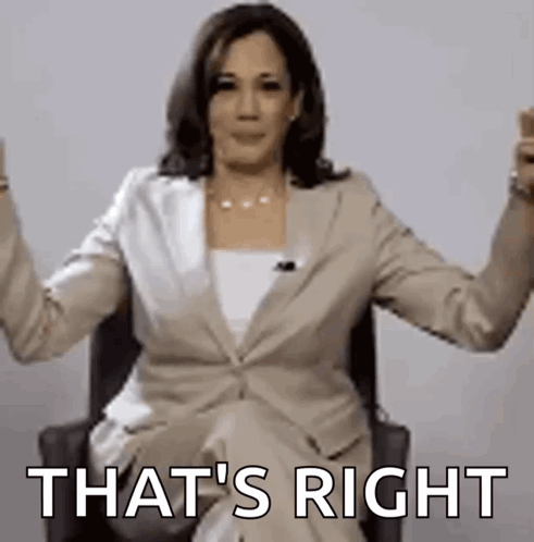 A Woman In A Suit Is Sitting In A Chair With Her Arms Outstretched And The Words `` That 'S Right '' . GIF