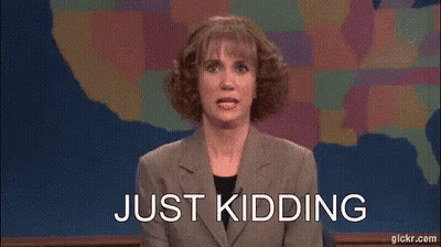 A Woman In A Suit Is Sitting In Front Of A Map Of The United States . GIF