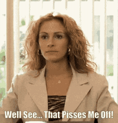 A Woman In A Suit Is Sitting In Front Of A Window And Says Well See That Pisses Me Off GIF