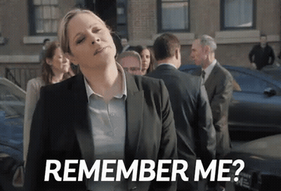 A Woman In A Suit Is Standing In Front Of A Crowd And Says `` Remember Me '' . GIF