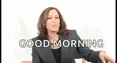 A Woman In A Suit Says Good Morning While Dancing GIF