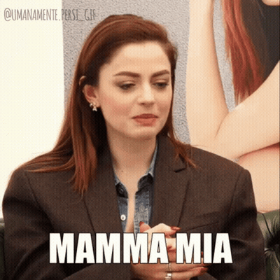 A Woman In A Suit Says Mamma Mia GIF