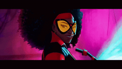 A Woman In A Superhero Costume Is Smiling GIF