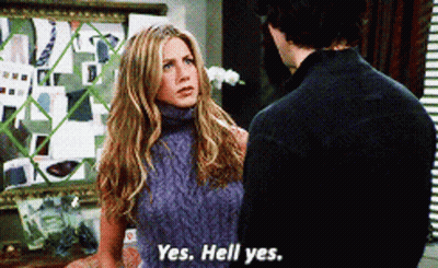 A Woman In A Sweater Says Yes Hell Yes To A Man GIF