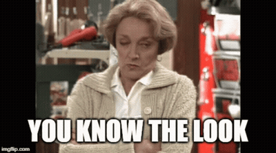 A Woman In A Sweater With The Words You Know The Look Written On It GIF