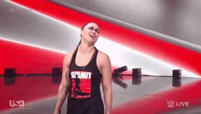 A Woman In A Tank Top With The Word Submit On It GIF
