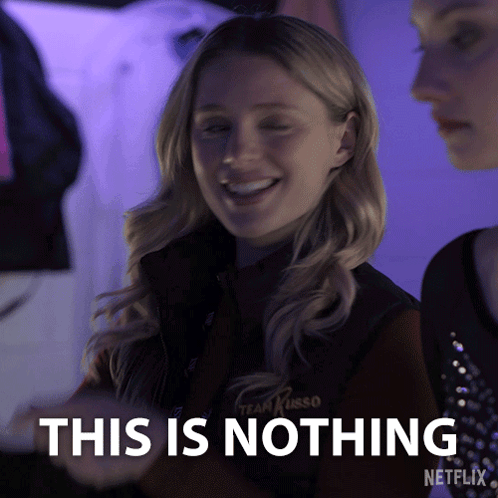 A Woman In A Team Kirso Vest Is Smiling And Says This Is Nothing GIF