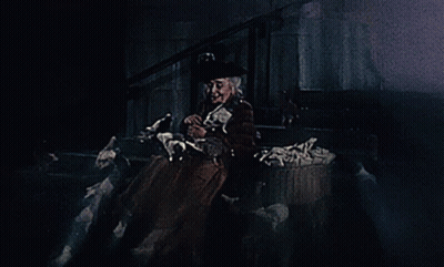 A Woman In A Top Hat Is Holding A Ghost GIF