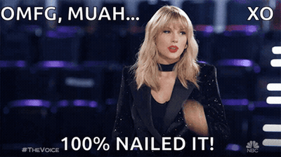 A Woman In A Tuxedo With The Words Omfg Muah 100 % Nailed It On The Bottom GIF