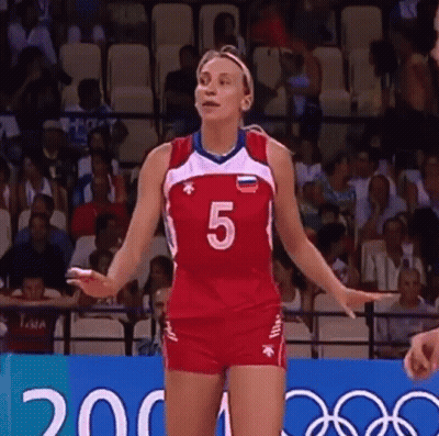 A Woman In A Volleyball Uniform With The Number 5 On It GIF