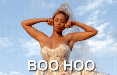 A Woman In A Wedding Dress Is Covering Her Ears With Her Hands And The Words Boo Hoo Are Below Her GIF
