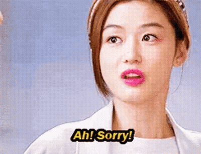 A Woman In A White Coat Is Making A Funny Face And Saying `` Ah ! Sorry ! '' GIF