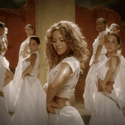 A Woman In A White Crop Top With The Number 4 On The Back GIF