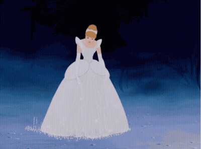A Woman In A White Dress And Gloves Is Standing On A Snowy Surface GIF