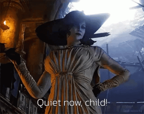 A Woman In A White Dress And Hat Is Standing In A Dark Room Holding A Gun And Saying Quiet Now Child . GIF