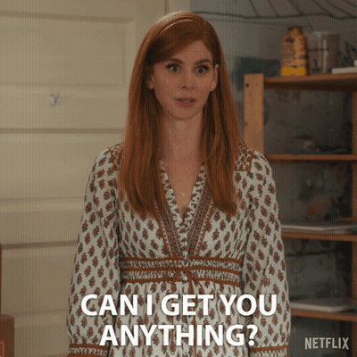A Woman In A White Dress Is Asking If She Can Get You Anything GIF