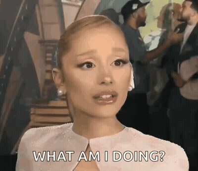 A Woman In A White Dress Is Asking What Am I Doing ? GIF