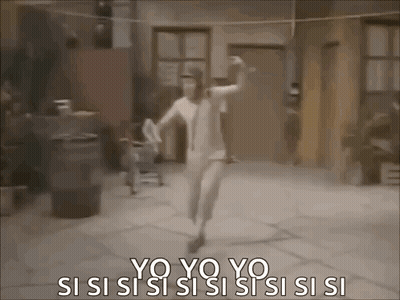 A Woman In A White Dress Is Dancing In Front Of A Building . GIF