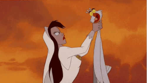 A Woman In A White Dress Is Holding A Bird In Her Hand GIF