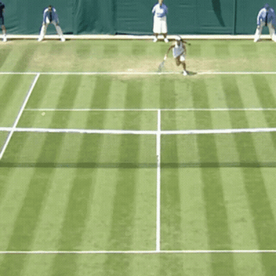 A Woman In A White Dress Is Holding A Tennis Racquet GIF