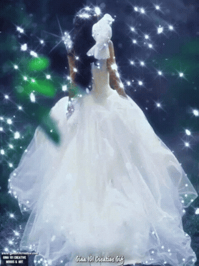A Woman In A White Dress Is Holding A White Bird On Her Head GIF