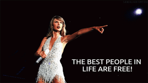 A Woman In A White Dress Is Pointing With The Words " The Best People In Life Are Free " Below Her GIF