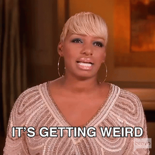A Woman In A White Dress Is Saying " It 'S Getting Weird " GIF