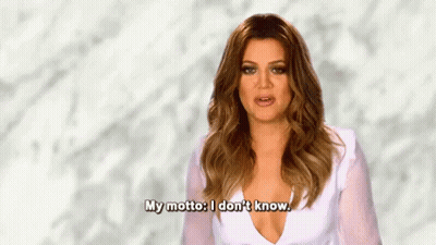 A Woman In A White Dress Is Saying `` My Motto : I Don 'T Know . '' GIF
