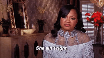 a woman in a white dress is saying she ain t right