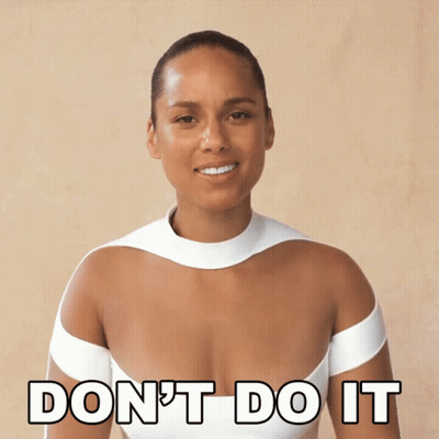 A Woman In A White Dress Is Smiling And Says " Don 'T Do It " GIF