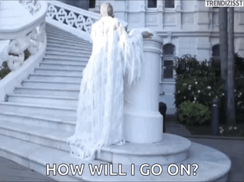 A Woman In A White Dress Is Standing On A Set Of Stairs And Says How Will I Go On . GIF