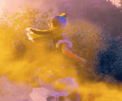A Woman In A White Dress Is Surrounded By Yellow And Purple Smoke GIF