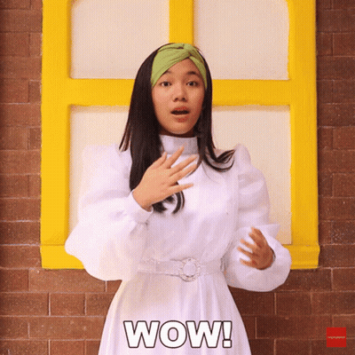 A Woman In A White Dress Says Wow GIF