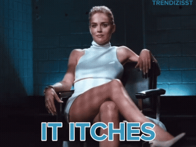 A Woman In A White Dress Sits In A Chair With The Words " It Itches " Below Her GIF