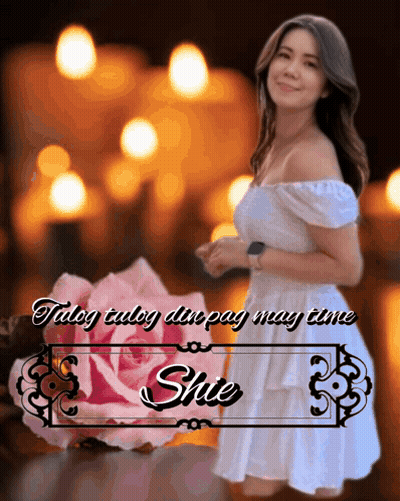 A Woman In A White Dress Stands In Front Of A Pink Rose And A Sign That Says Shute GIF