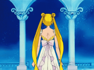 A Woman In A White Dress With A Bow On The Back GIF
