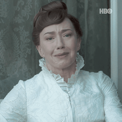 A Woman In A White Dress With A Hbo Logo On The Bottom Left GIF
