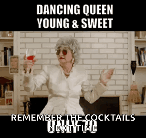 A Woman In A White Jacket Is Holding A Glass Of Red Wine And Dancing GIF