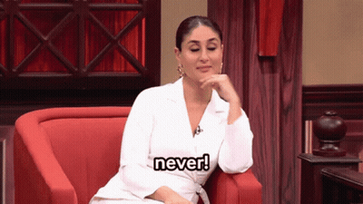A Woman In A White Jacket Is Sitting In A Red Chair And Says " Never " GIF